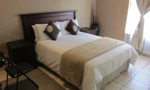 Private single bedroom with desk and natural light